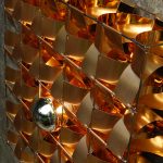 Détail Atlas applique cuivre